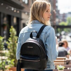 “Sling It. Zip It. Go. 💼🔥 Steve Madden Made